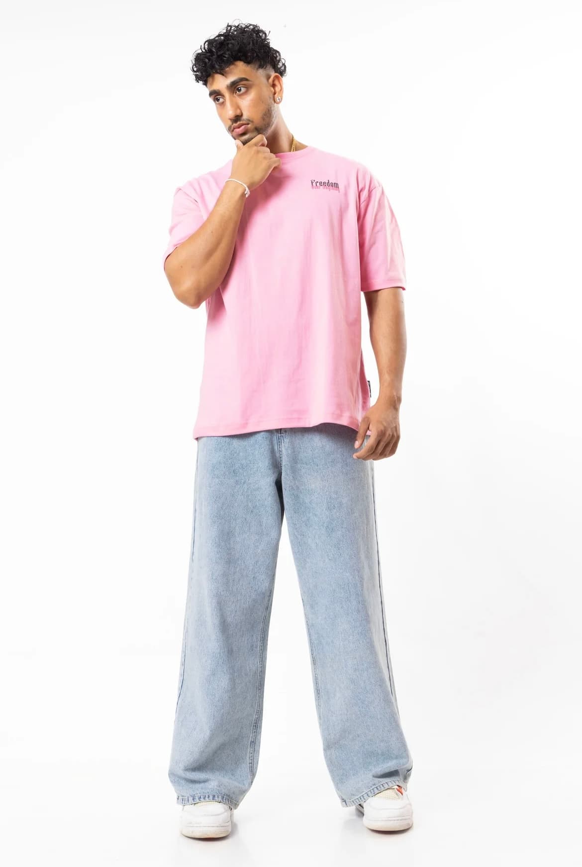FOA Freedom pink t-shirt full body shot with wide-leg jeans