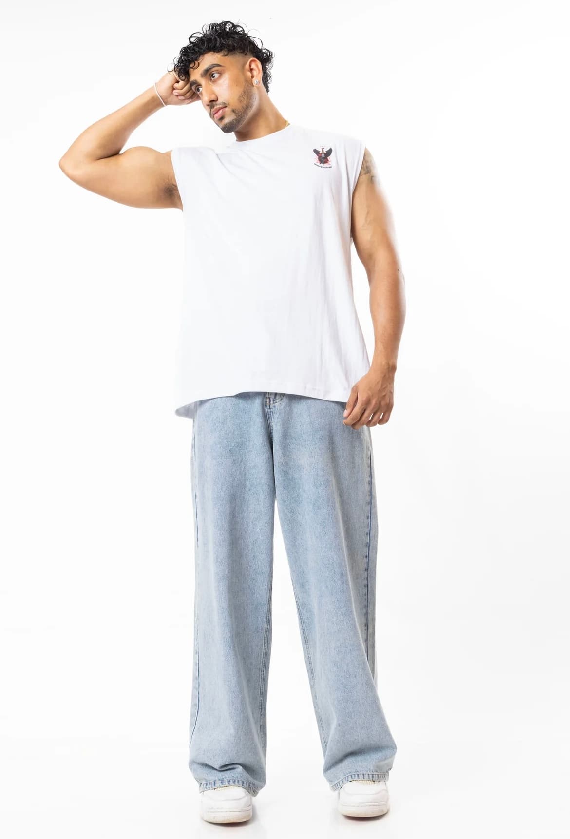 FOA white tank casual pose with hand to head